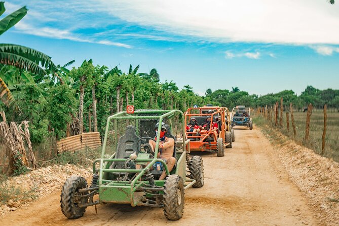 Line of dune buggies on a countryside trail in Punta Cana